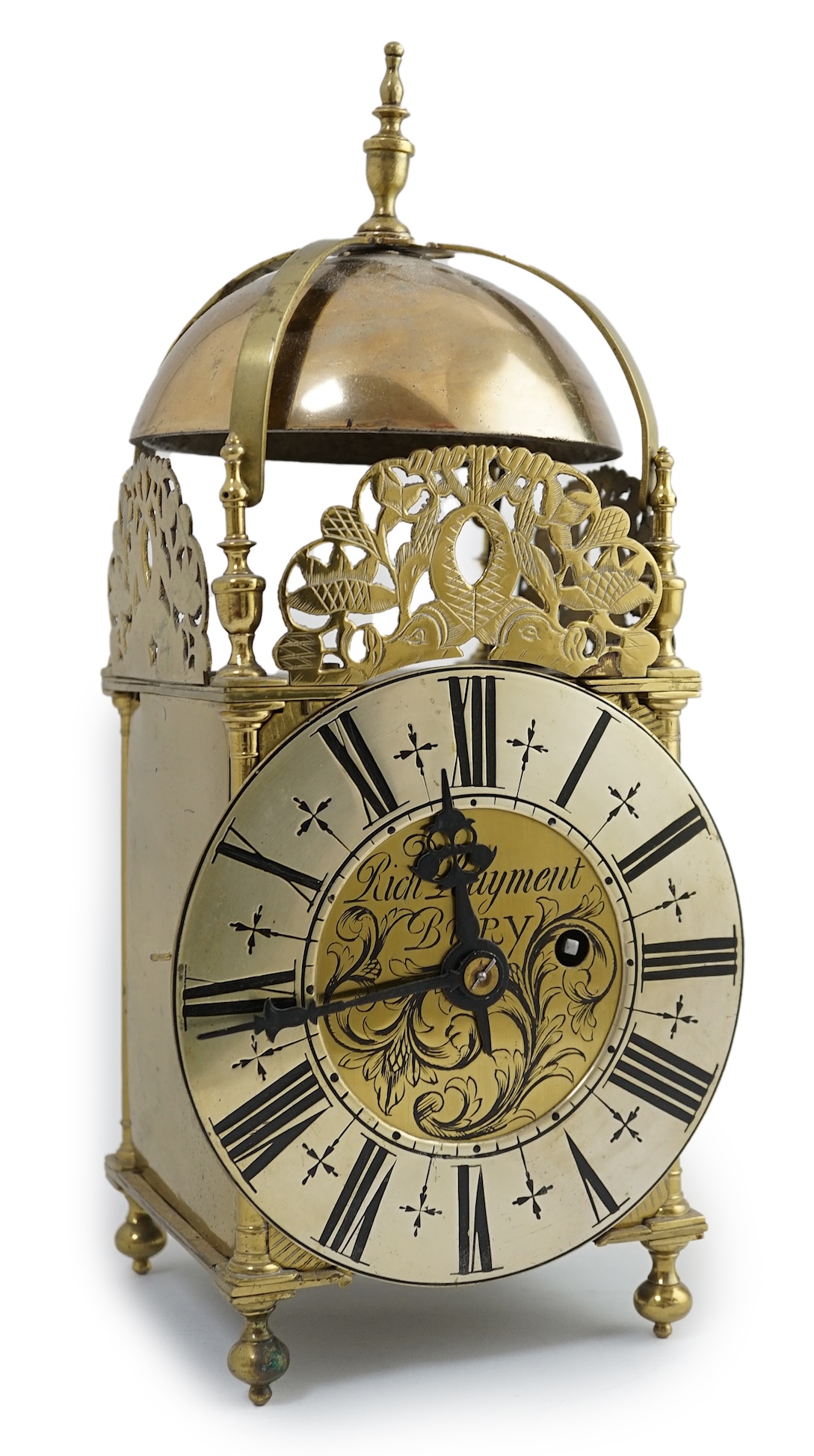 Manner of Richard Rayment of Bury. A Victorian 17th century style lantern clock, in traditional brass case with silvered Roman dial and eight day single fusee movement striking on a bell, 17cm wide, 14.5cm deep, 38cm hig